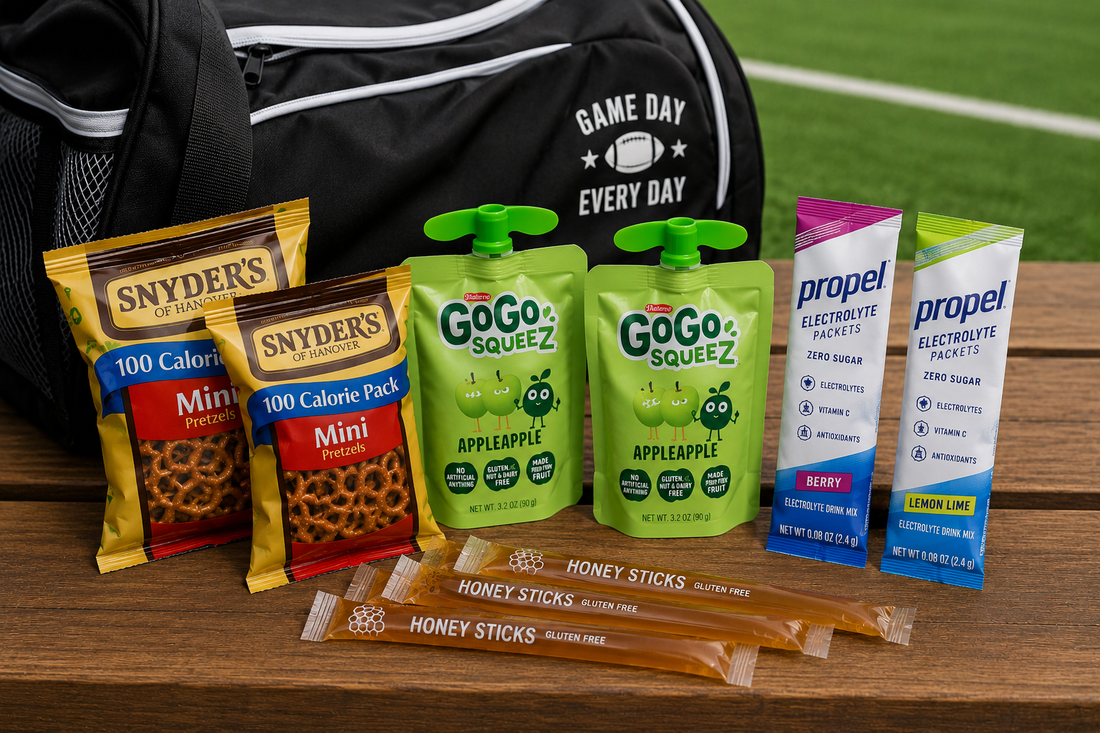 Healthy sports snacks including pretzels applesauce electrolyte packets and honey sticks for young athletes